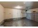 Spacious two-car garage features an automatic door opener, concrete floor and cinder block base walls at 1960 Morning Nw Walk, Acworth, GA 30102