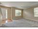 Bright and airy living room with plush carpet, large windows, and access to the front entrance at 1960 Morning Nw Walk, Acworth, GA 30102