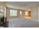 Open-concept living room featuring fireplace and neutral tones at 1960 Morning Nw Walk, Acworth, GA 30102