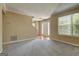 Bright living room featuring neutral walls and plush gray carpeting at 1960 Morning Nw Walk, Acworth, GA 30102