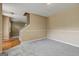 Spacious living room features neutral paint, carpeting, and a view to the stairway at 1960 Morning Nw Walk, Acworth, GA 30102