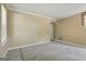 Neutral living room features soft carpeting, bright windows, and easy access to other rooms at 1960 Morning Nw Walk, Acworth, GA 30102