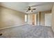 Expansive main bedroom with fan, carpet, and doors to bathroom and closet at 1960 Morning Nw Walk, Acworth, GA 30102