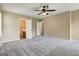 Large main bedroom with ceiling fan, carpet, and doors to bath and closet at 1960 Morning Nw Walk, Acworth, GA 30102