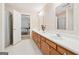 Bathroom featuring a double vanity, and a view into the bedroom at 9255 Betony Wood Trl, Jonesboro, GA 30236