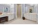 Bright bathroom with double vanity, tiled floors, and shower at 9255 Betony Wood Trl, Jonesboro, GA 30236