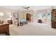 Spacious bedroom featuring a four-poster bed, bay window, and neutral tones at 9255 Betony Wood Trl, Jonesboro, GA 30236