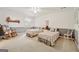 Cozy bedroom with twin beds, rocking chair, and charming decor at 9255 Betony Wood Trl, Jonesboro, GA 30236
