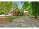 Lovely home featuring a two-car garage and mature trees, offering a peaceful and private setting at 9255 Betony Wood Trl, Jonesboro, GA 30236