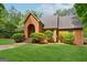 Beautiful brick house with a well-manicured lawn and mature landscaping adding to its curb appeal at 9255 Betony Wood Trl, Jonesboro, GA 30236