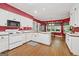 Spacious kitchen featuring white cabinets, butcher block countertops, and a bright breakfast nook at 9255 Betony Wood Trl, Jonesboro, GA 30236