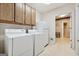 Functional laundry room with washer, dryer, and extra storage at 9255 Betony Wood Trl, Jonesboro, GA 30236