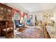 Cozy living room with hardwood floors, a decorative rug, and an abundance of natural light at 9255 Betony Wood Trl, Jonesboro, GA 30236