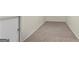 Unfinished basement with carpet flooring and ample space for storage or customization at 1029 Ector Nw Dr, Kennesaw, GA 30152