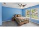Blue bedroom with natural light, and comfortable gray carpet at 1029 Ector Nw Dr, Kennesaw, GA 30152