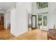 Grand foyer with soaring ceilings, gleaming hardwood floors, and a decorative glass front door, creating a welcoming entrance at 1029 Ector Nw Dr, Kennesaw, GA 30152