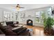 Comfortable living room with fireplace, natural light, and view of backyard at 1029 Ector Nw Dr, Kennesaw, GA 30152