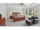 Spacious main bedroom features a trey ceiling, large windows, and a cozy seating area at 1029 Ector Nw Dr, Kennesaw, GA 30152