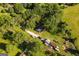Overhead view of a home surrounded by lush greenery, showcasing a peaceful, wooded environment with ample parking at 316 Gaithers Rd, Mansfield, GA 30055