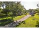 Gorgeous aerial view of a well-maintained property with a large home, outbuildings, and a picturesque gravel driveway at 316 Gaithers Rd, Mansfield, GA 30055