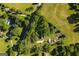 Aerial view of a country estate showcasing mature trees, expansive lawns, and charming outbuildings at 316 Gaithers Rd, Mansfield, GA 30055