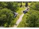 Aerial view displaying the charming home with its surrounding yard, outbuildings and long driveway at 316 Gaithers Rd, Mansfield, GA 30055