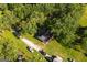 Aerial view of a house nestled among mature trees, revealing the property's secluded location and spacious yard at 316 Gaithers Rd, Mansfield, GA 30055