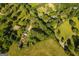 Picturesque aerial shot featuring a house, pool, and expansive grounds, highlighting the property's privacy and amenities at 316 Gaithers Rd, Mansfield, GA 30055
