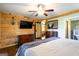 Comfortable bedroom with hardwood floors, barn door leading to the bathroom at 316 Gaithers Rd, Mansfield, GA 30055