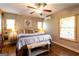Serene bedroom retreat featuring soft colors, hardwood floors, and a ceiling fan at 316 Gaithers Rd, Mansfield, GA 30055