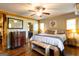 Cozy bedroom featuring hardwood floors and views to an ensuite bathroom at 316 Gaithers Rd, Mansfield, GA 30055