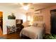 This serene bedroom has hardwood floors, neutral walls, a comfortable bed and bright natural light at 316 Gaithers Rd, Mansfield, GA 30055