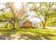 Charming exterior view highlighting a home's inviting porch surrounded by mature trees and a well-kept lawn at 316 Gaithers Rd, Mansfield, GA 30055