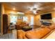 Inviting living room features a TV, wood accents, comfortable sofas, and natural light at 316 Gaithers Rd, Mansfield, GA 30055