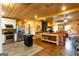 Open-concept kitchen and living area with hardwood floors and abundant natural light at 316 Gaithers Rd, Mansfield, GA 30055