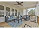Inviting back porch with ceiling fan and plenty of seating for outdoor entertaining at 415 Discovery Lake Dr, Fayetteville, GA 30215