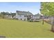 Large backyard featuring a playset and plenty of space for outdoor activities at 415 Discovery Lake Dr, Fayetteville, GA 30215