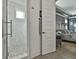 Beautiful walk-in shower with elegant tile, seamlessly connected to the main bedroom at 415 Discovery Lake Dr, Fayetteville, GA 30215