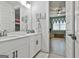 Bright bathroom showcasing a modern double sink vanity connected to the bunkroom at 415 Discovery Lake Dr, Fayetteville, GA 30215