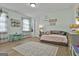 Bright bedroom with natural light, decorative accents, and a full-size daybed at 415 Discovery Lake Dr, Fayetteville, GA 30215