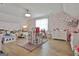 Spacious bedroom featuring two twin beds, hardwood floors, and a large area rug at 415 Discovery Lake Dr, Fayetteville, GA 30215