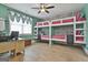 Fun bunkroom with custom bunkbeds, stylish wallpaper, and natural light at 415 Discovery Lake Dr, Fayetteville, GA 30215