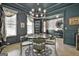 Elegant dining room with chandelier, stylish decor, dark trim, and easy access to the foyer at 415 Discovery Lake Dr, Fayetteville, GA 30215