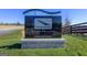 Prominent sign for Pinewood Atlanta Studios at the entrance, set against a green lawn at 415 Discovery Lake Dr, Fayetteville, GA 30215