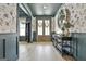 Elegant foyer with hardwood floors, decorative wallpaper, and stylish console table at 415 Discovery Lake Dr, Fayetteville, GA 30215