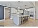 Bright kitchen with white cabinets, stainless steel appliances, and a large island at 415 Discovery Lake Dr, Fayetteville, GA 30215