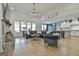 Open-concept living room with high ceilings, hardwood floors, and seamless kitchen access at 415 Discovery Lake Dr, Fayetteville, GA 30215