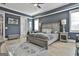 Main bedroom featuring neutral decor, natural light, wood floors, and a large decorative area rug at 415 Discovery Lake Dr, Fayetteville, GA 30215