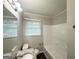 Clean bathroom with a granite vanity top, tub and modern fixtures at 3375 Brenda Ln, Lithia Springs, GA 30122