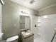 Cozy bathroom featuring granite countertops, a shower with shelves and a white surround at 3375 Brenda Ln, Lithia Springs, GA 30122